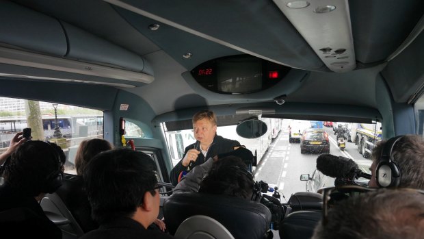 Borisovich conducts a bus tour.