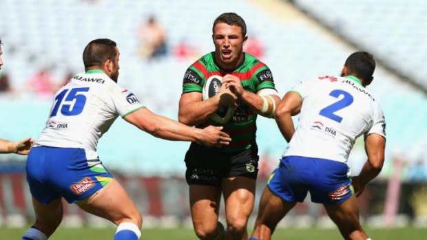 Faster game: Raiders players move in to tackle Sam Burgess.