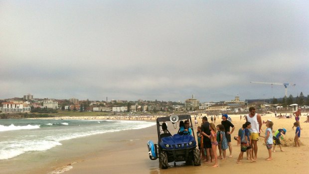 Bondi Lifeguards patrol the beach after swimmers were evacuated.