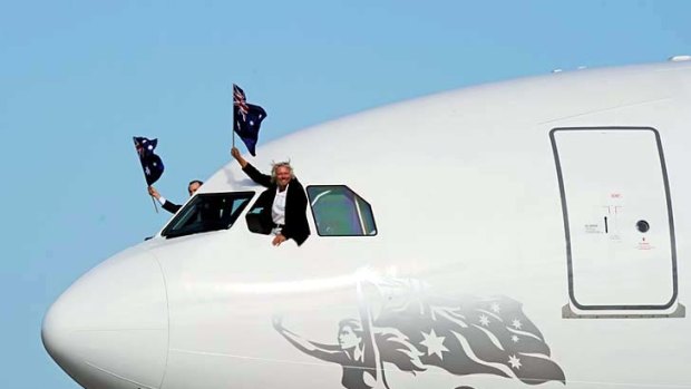 Richard Branson (R) and Virgin Australia CEO, John Borghetti (L) arrive on the new airline's Airbus A330-200 at Sydney Airport.