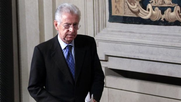 Newly appointed Prime Minister Mario Monti walks following a talk with Italian President Giorgio Napolitano.