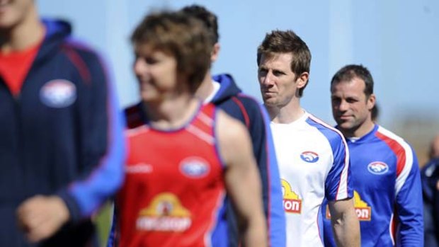 It was blues skies at the Whitten Oval yesterday when Dale Morris (centre) was given the all clear to return against St Kilda on Saturday night.