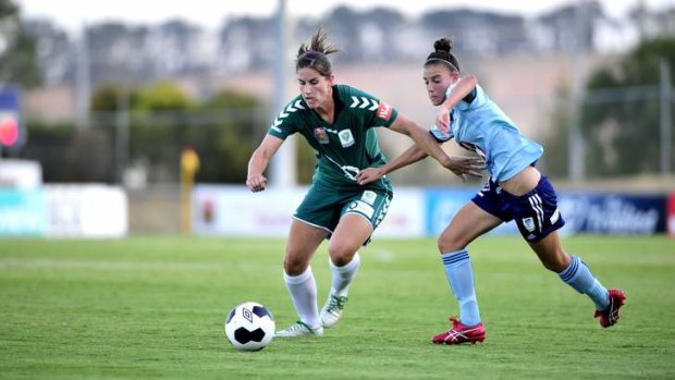 Canberra United's Caitlin Munoz and Sydney FC's  Chloe Logarzo clash in January.
