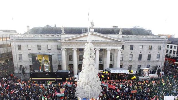 Crowds gather in front of the General Post Office Building  in Dublin.