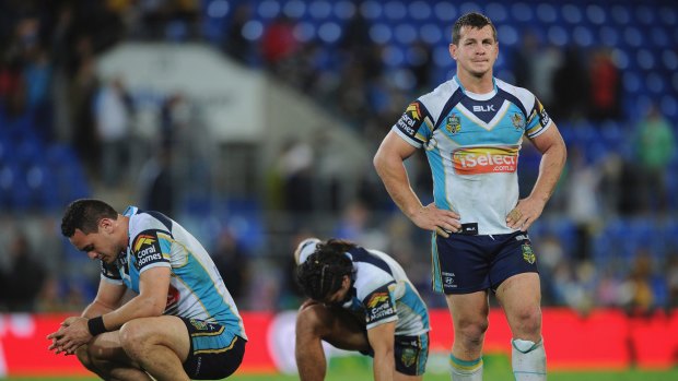 Uncertain future: Greg Bird and his Titans teammates look dejected following a Parramatta try at Cbus Super Stadium in July.