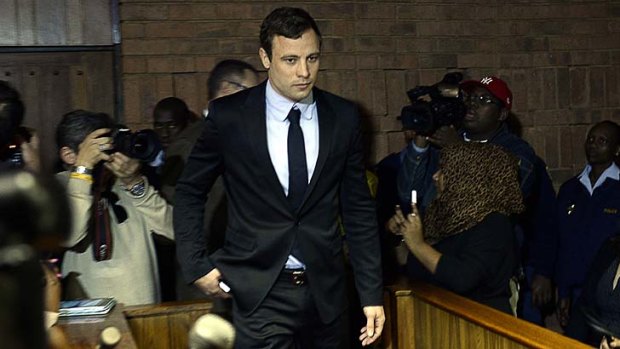 Back in court: South African Olympic sprinter Oscar Pistorius at the Magistrates Court to hear charges over his girlfriend's death.