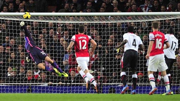 Arsenal midfielder Aaron Ramsey (right) scores his team's second goal during the match against Liverpool on Saturday.