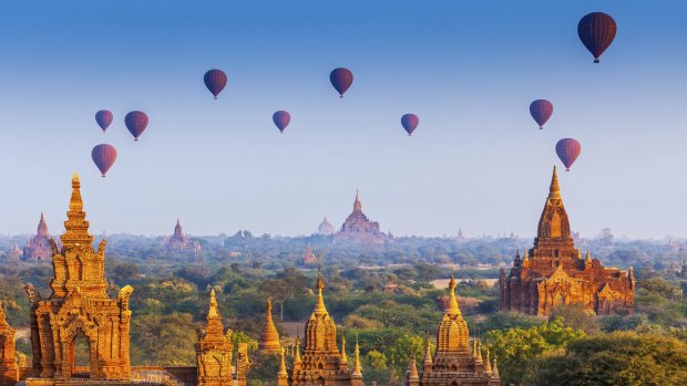 Balloons fly above temples in Bagan, Myanmar. 