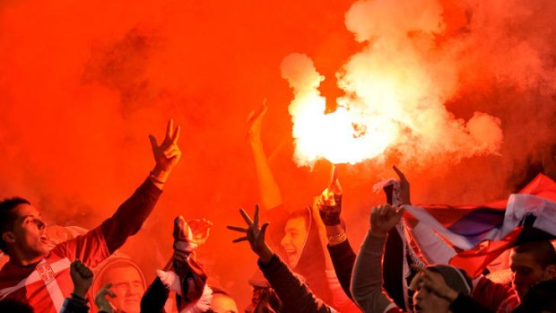 Serbian fans at the Australia-Serbia international soccer friendly in June light flares and give the three-fingered salute of the nationalist Chetniks.
