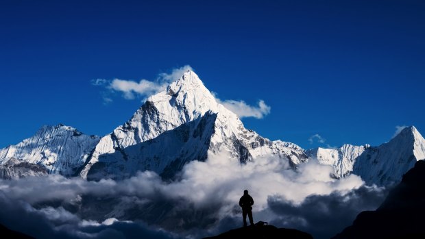 A climber looks on at Mount Everest in the Himalayas.