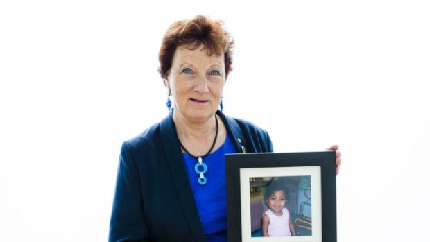 Sandra Mahlberg, ACT Senior Australian of the Year, with a photo of Finova Dos Santos who was brought from Timor Leste for life-saving surgery