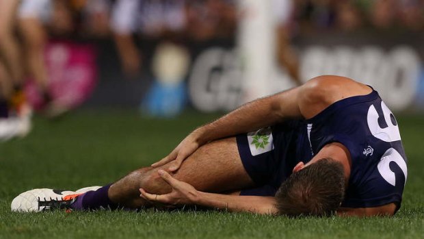 Kepler Bradley of the Dockers grabs his right knee during the round five AFL match between the Fremantle Dockers and the Richmond Tigers at Patersons Stadium on April 26, 2013 in Perth, Australia.