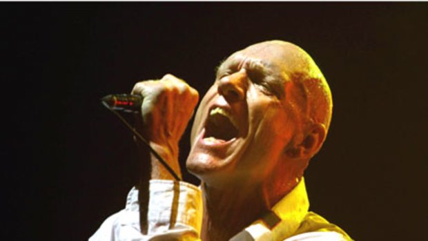 Peter Garrett in action with Midnight Oil at Sydney's Wave Aid benefit in 2006.