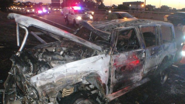 The Nissan patrol that crashed and burst into flames on the freeway.