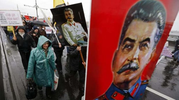 People carry posters of late Soviet leader Joseph Stalin as they attend a "Patriotic March" demonstration, organized by the Rodina (Motherland) political party, on National Unity Day in St. Petersburg.