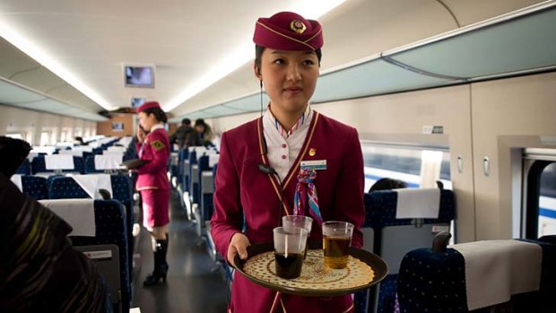 Toilets on the world's longest bullet train service (China) are of stainless steel squat variety, with slightly more bathroom space than would usually be found on an airliner, while uniformed women were on hand to serve drinks and snacks during the trip.