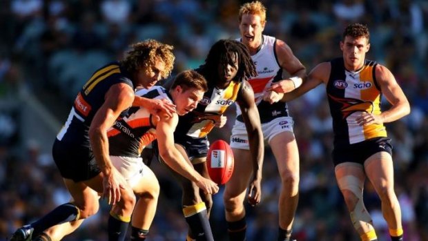 Nic Naitanui, seen here contesting possession with Toby Greene of GWS, says that the Eagles now have the confidence to beat the Pies.