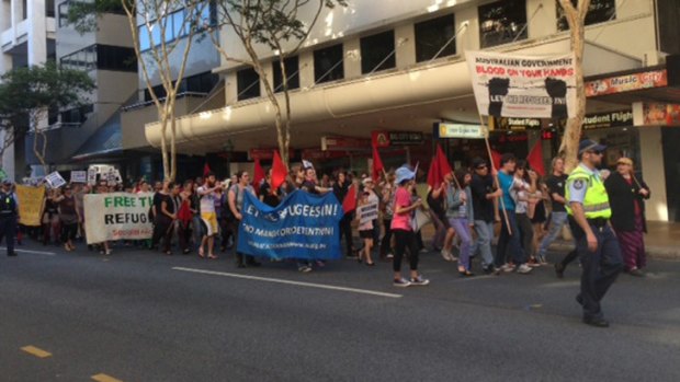 Hundreds of Brisbane residents walk down Adelaide Street protesting the Rudd government's new asylum seeker policy.