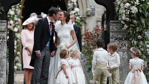 Pippa Middleton and James Matthews kiss after their wedding.