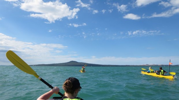 The band of kayakers head straight for  Rangitoto Island.