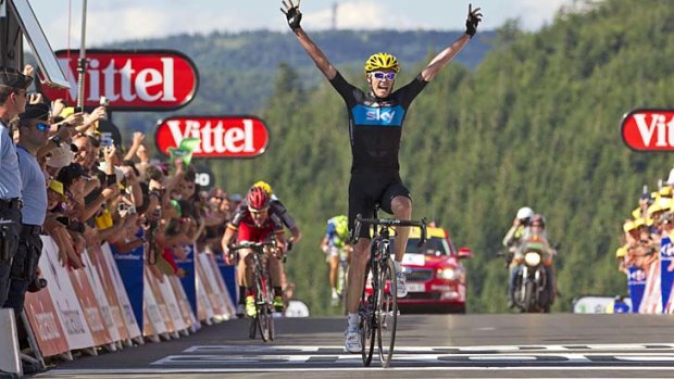 Chris Froome of Great Britain celebrates winning stage 7 ahead of Cadel Evans.