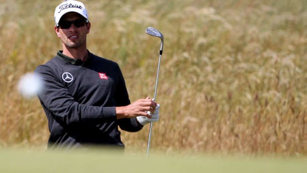 Links to the past: Adam Scott during a practice round at Muirfield on Monday. The US Masters champion suffered a final-round meltdown at the British Open last year.