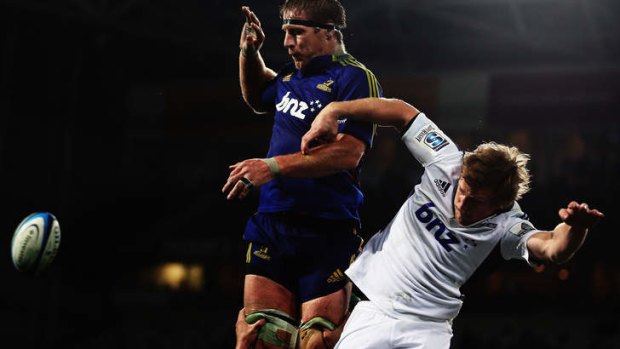 Brad Thorn of the Highlanders climbs above Brendon O'Connor of the Blues.