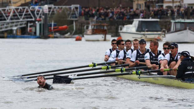The Oxford crew looks on as protester Trenton Oldfield disrupts the boat race between Oxford and Cambridge in 2012.
