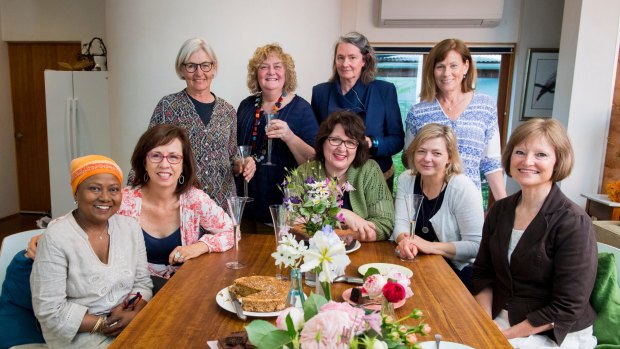 The Singed Sisters were a group of women who supported each other in the aftermath of the January 2003 bushfires. Nearly 15 years after the disaster, the sisters have released a cookbook which tracks their journey from devastation to celebration. Pictured are (standing l-r): Liz Walter, Jane Fitzgerald, Peta Mackenzie Davey and  Julie Pham and 
(seated l-r) Chandani Prammer, Liz Tilley, Alison Mills, Karen Downinga dn Sue Kukolic