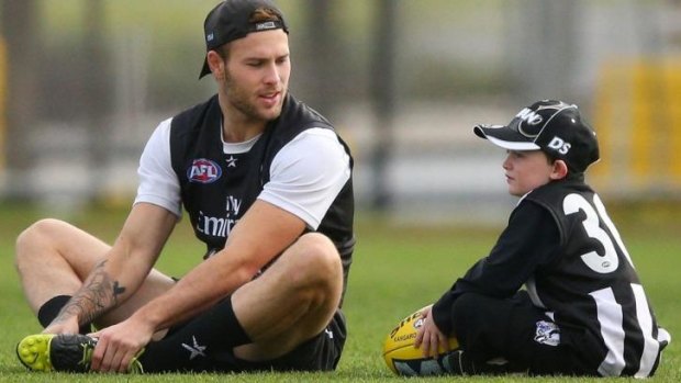 Brent Macaffer with a young fan at training on Wednesday.
