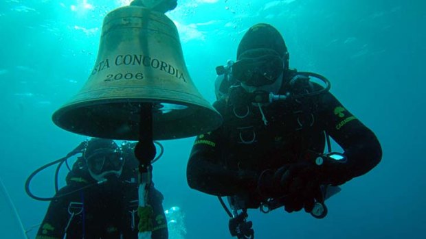 Police divers search for more than 20 people still missing on the partially submerged Costa Concordia off the Italian island of Giglio.