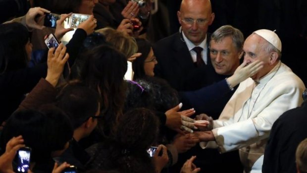 Pope Francis meets the faithful after leading an audience with families of victims of the mafia in Rome.