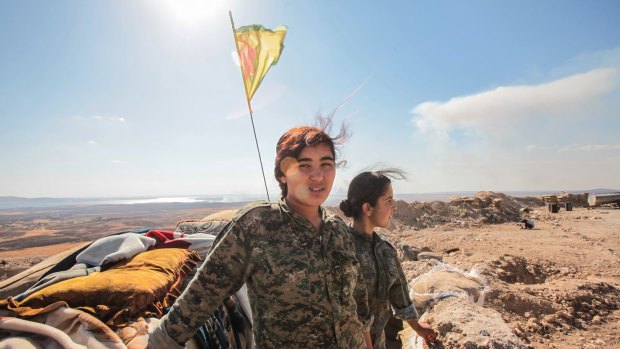 Women members of the  Kurdish People's Protection Units, or YPG, a group that is fighting Islamic State. Despite their being approximate "goodies", Tony Abbott has dismissed all groups fighting in Syria as "baddies versus baddies".