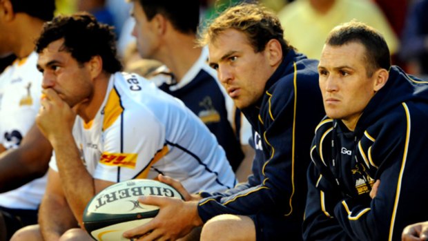 Quitting international rugby ... George Smith, left, sits on the bench during the Brumbies v Waratahs trial match last night.