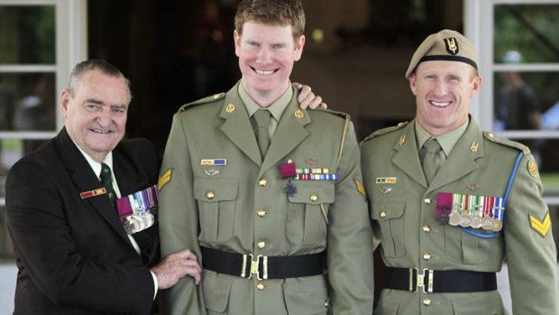 Heroes all ... Corporal Daniel Keighran VC is congratulated by WO2 (retired) Keith Payne VC, left, and SAS Corporal Mark Donaldson VC at Government House in Canberra on Thursday.