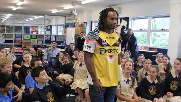 Eyes on the Tiger &#8230; Lote Tuqiri, modelling his side's latest strip, spoke to children at St Ambrose Primary School in Concord West yesterday.