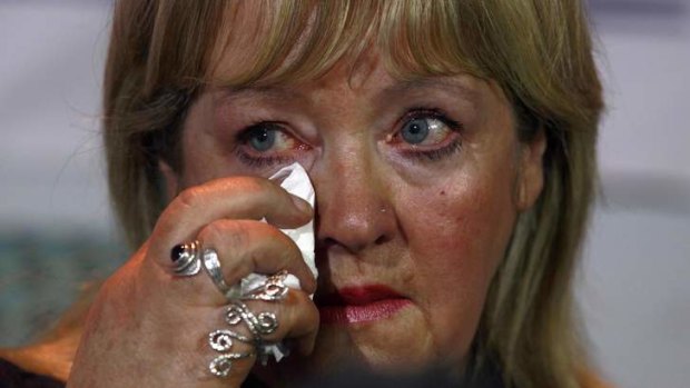 Maureen Sullivan who worked in a "Magdalene Laundry", wipes a tear during a "Magdalene Survivors Together" news conference in Dublin.