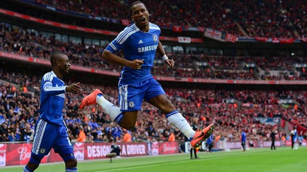 Leap of faith: The irrepressible Didier Drogba, right, and Salomon Kalou celebrate the decisive goal against Liverpool yesterday.