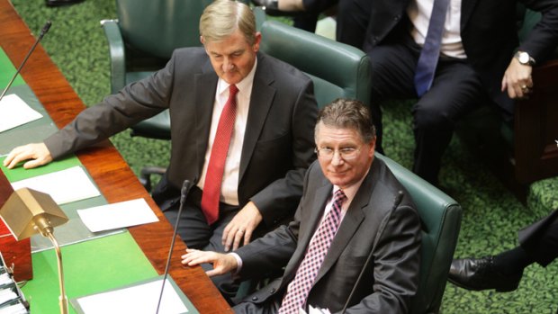 Premier Denis Napthine, right,  takes his seat for the first sitting day of State Parliament since the leadership change.