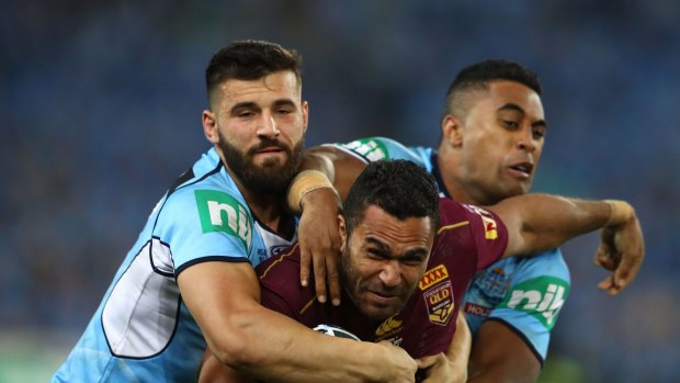 Justin O'Neill is tackled during Origin I. Blues officials believe O'Neill suffered concussion.