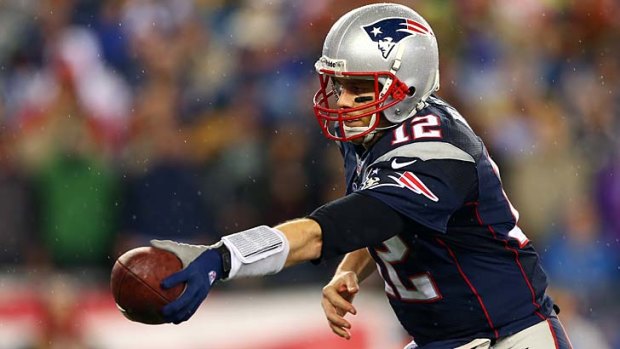 Tom Brady hands off the ball against the Colts.