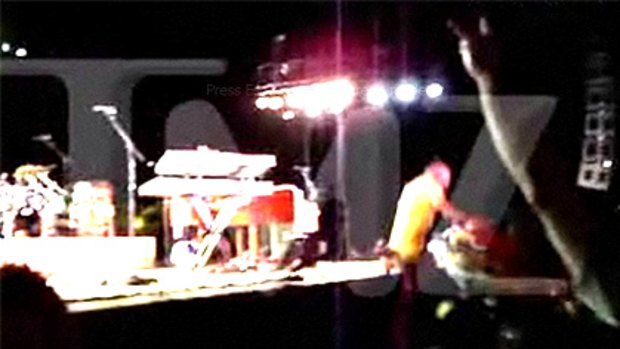 A concertgoer captures Jimmy Buffett's fall from the stage.