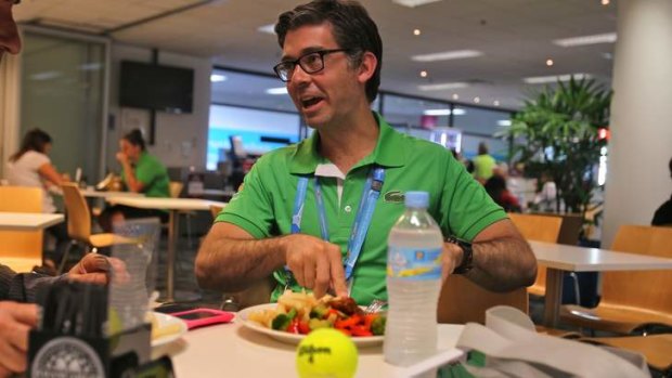 Ready to serve: Darren Sturgess tucks in at the media restaurant at the Rod Laver Arena. ''I actually don't get to see many matches.''
