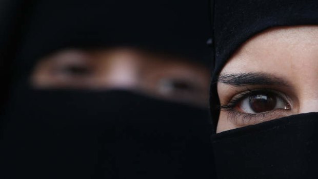 Two women wearing niqab veils.