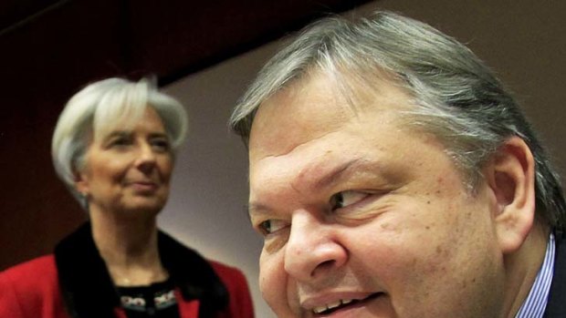 "We have to do whatever we have to do to get the program approved" ... Evangelos Venizelos and Christine Legarde after talks in Brussels.