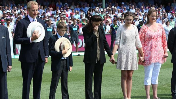 Respect &#8230; the family of the late Tony Greig - sons Mark and Tom, wife Vivian, and daughters Beau and Samantha - pay their respects at the SCG on Thursday. Photo: