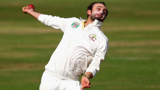 On a roll: Nathan Lyon on his way to claiming 3-80.