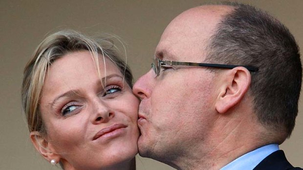 Awkward ... Prince Albert of Monaco kisses Princess Charlene in South Africa.