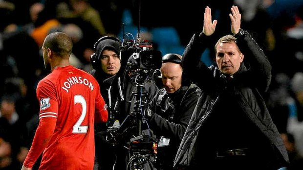 Not happy: Liverpool manager Brendan Rodgers applauds the supporters after the loss to Manchester City.
