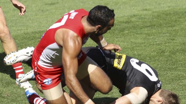 Power out &#8230; Port Adelaide's Jacob Surjan was left dazed after Sydney's Adam Goodes slid into him knees-first on Saturday at AAMI Stadium.